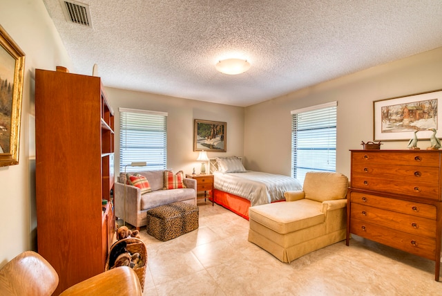 bedroom featuring a textured ceiling