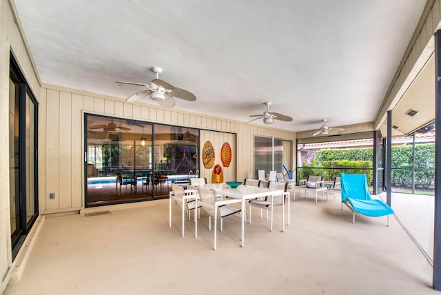 view of patio featuring ceiling fan