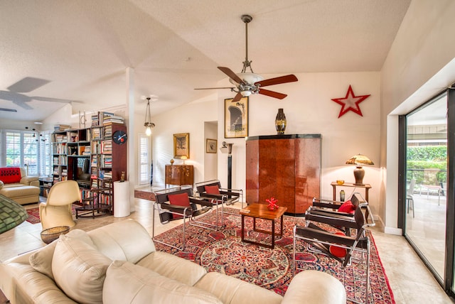 living room featuring lofted ceiling, a textured ceiling, and ceiling fan