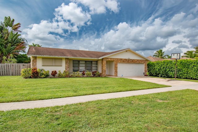 ranch-style home featuring a front yard and a garage