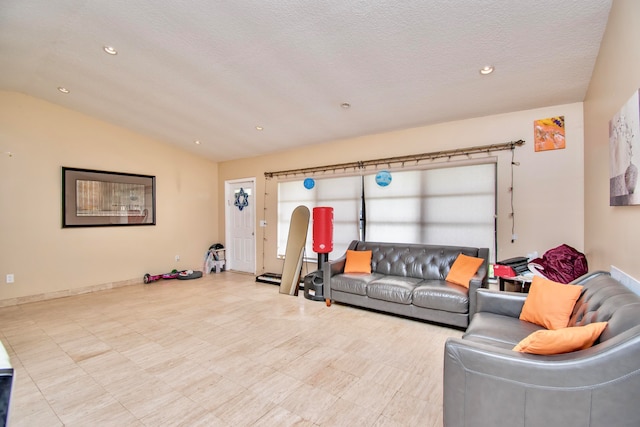 living room with a textured ceiling and vaulted ceiling