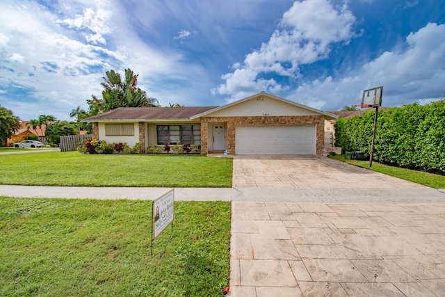 ranch-style home featuring a garage and a front lawn