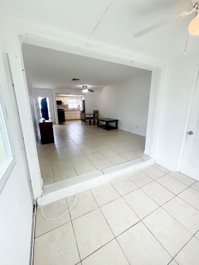 interior space featuring ceiling fan