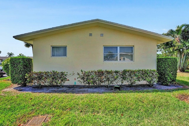 view of home's exterior featuring a lawn