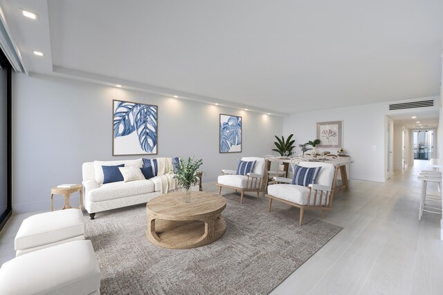 interior space featuring light brown cabinetry, expansive windows, kitchen peninsula, and light wood-type flooring