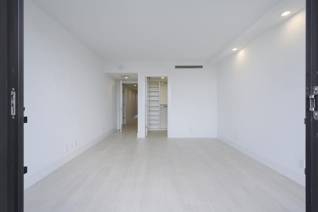 unfurnished room with light hardwood / wood-style flooring