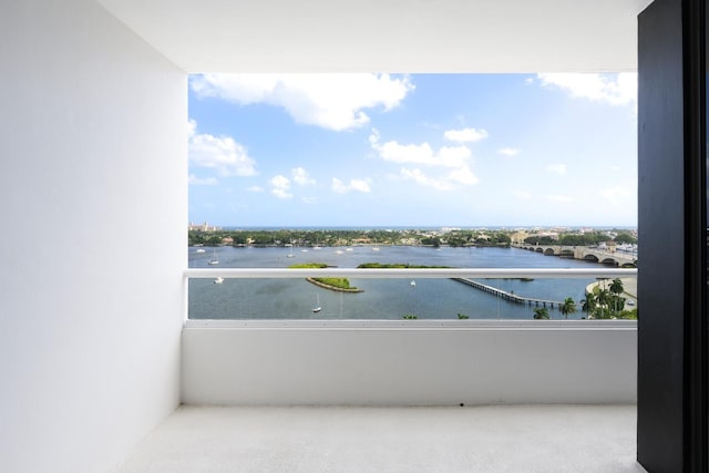 balcony featuring a water view