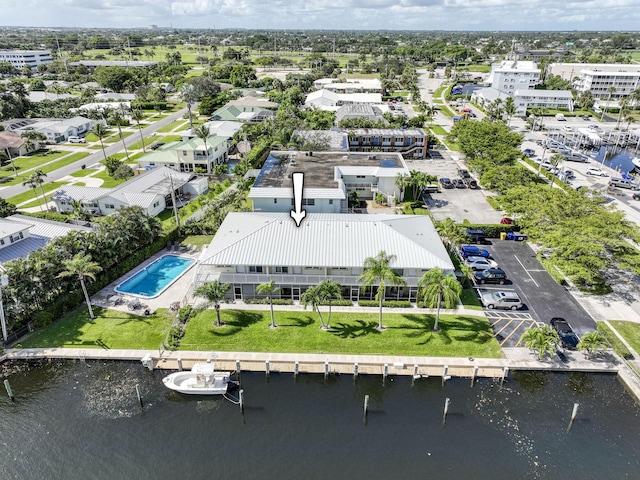 birds eye view of property with a water view