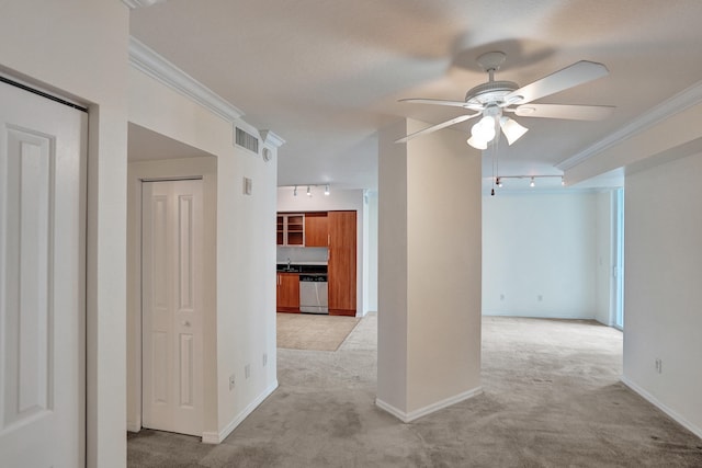 spare room with ornamental molding, light colored carpet, sink, and ceiling fan