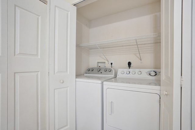 clothes washing area featuring washing machine and dryer