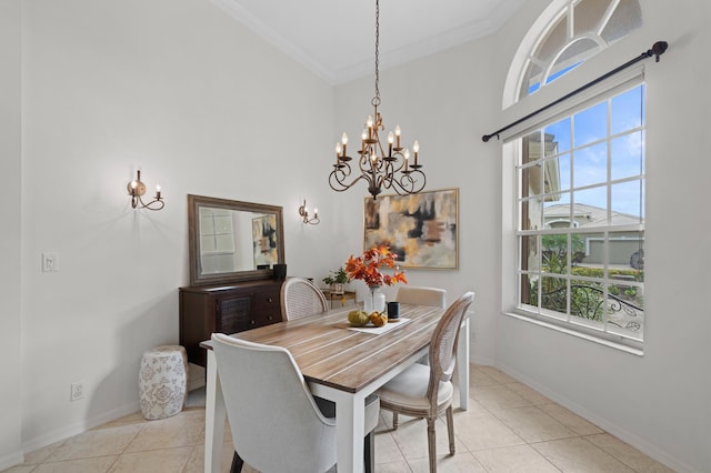 tiled dining space featuring a notable chandelier, a healthy amount of sunlight, and crown molding