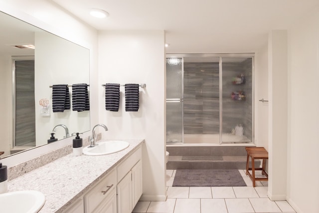 bathroom with vanity, bath / shower combo with glass door, and tile patterned flooring