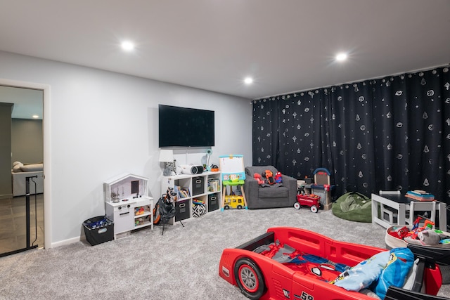 rec room featuring carpet flooring