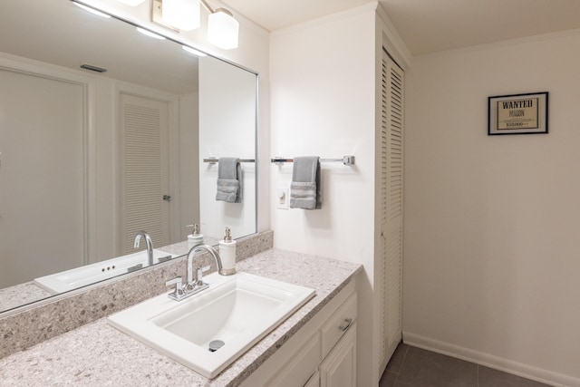 bathroom with vanity, tile patterned floors, and ornamental molding