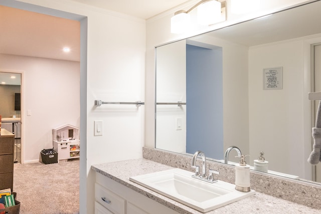 bathroom with vanity and crown molding