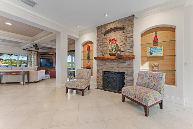 tiled living room featuring beam ceiling, coffered ceiling, ornamental molding, and a fireplace