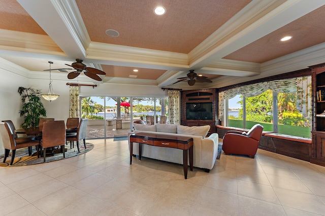 tiled living room featuring coffered ceiling, ceiling fan, beam ceiling, and crown molding