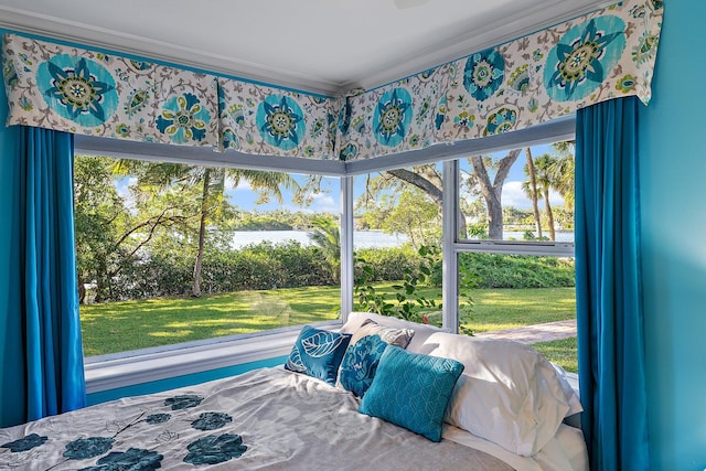 bedroom featuring crown molding and multiple windows