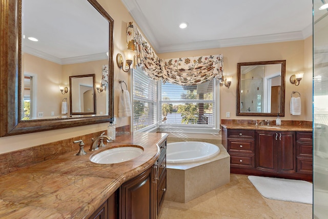 bathroom featuring tiled bath, vanity, tile patterned floors, and ornamental molding