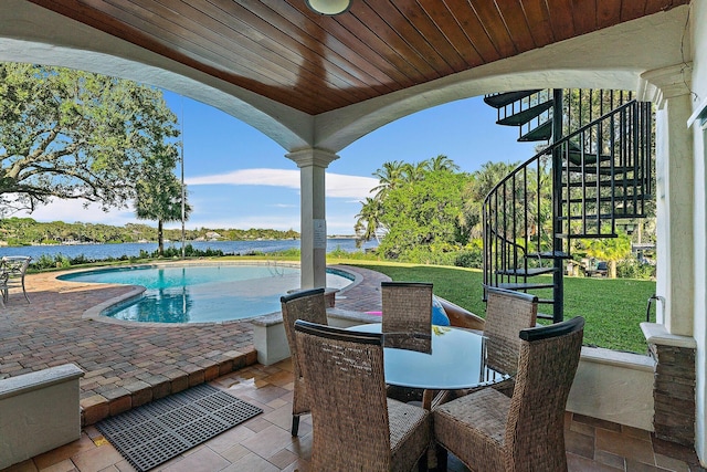 view of patio with a water view