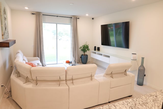 living room featuring a healthy amount of sunlight and light wood-type flooring