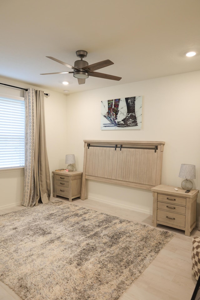 bedroom featuring light wood-type flooring and ceiling fan