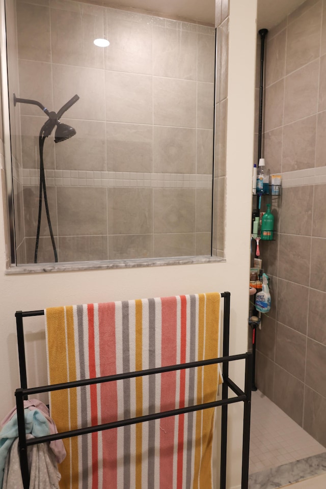 bathroom with tiled shower