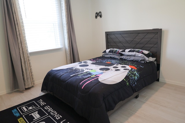 bedroom featuring light wood-type flooring