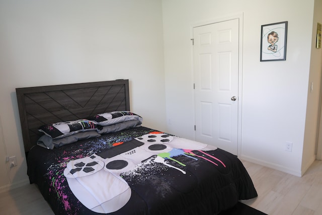 bedroom with light hardwood / wood-style flooring