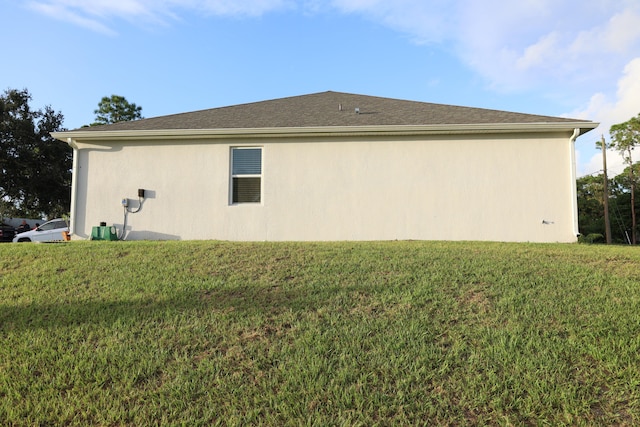 view of home's exterior with a yard