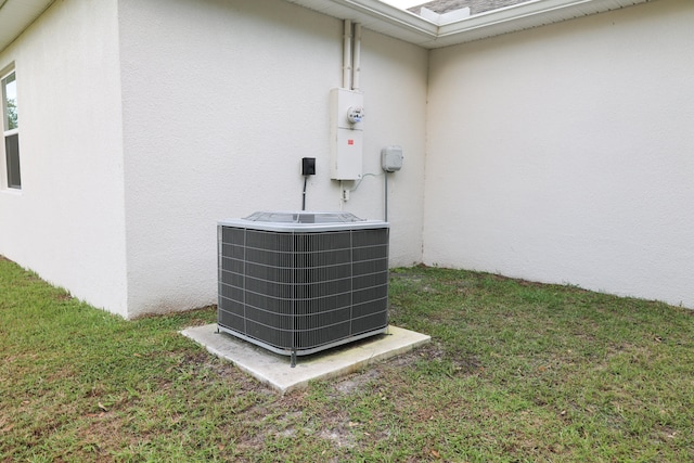 exterior details with carpet floors and central AC unit