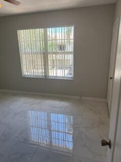 136 SW Peacock Blvd Unit 19-204, Port Saint Lucie, FL 34986 - empty room featuring a ceiling fan and baseboards