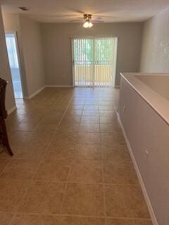 136 SW Peacock Blvd Unit 19-204, Port Saint Lucie, FL 34986 - empty room with baseboards and ceiling fan