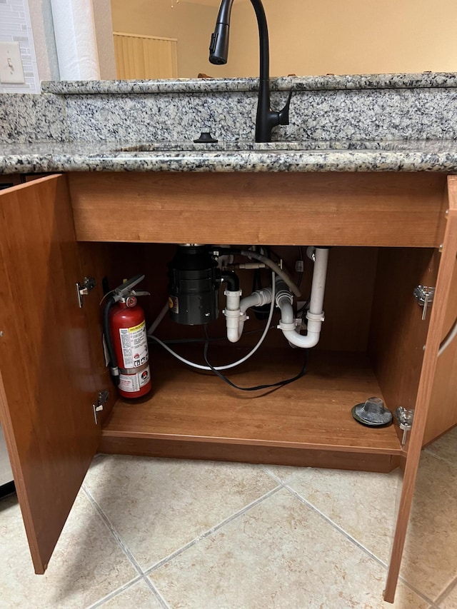 136 SW Peacock Blvd Unit 19-204, Port Saint Lucie, FL 34986 - detailed view of a fire extinguisher and a sink