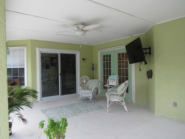 view of patio / terrace with french doors and ceiling fan