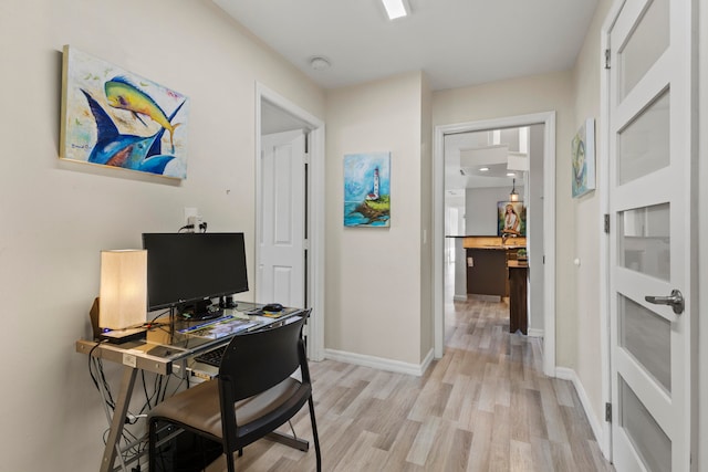 office area with light wood-type flooring