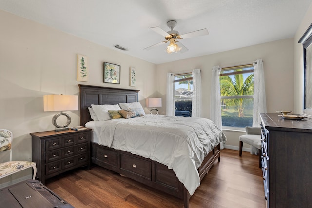 bedroom featuring ceiling fan and dark hardwood / wood-style flooring