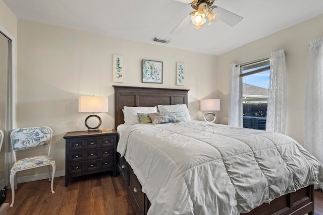 bedroom featuring dark hardwood / wood-style flooring and ceiling fan