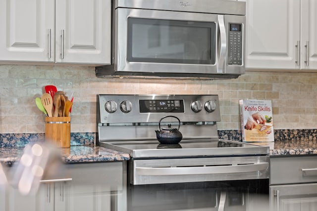 kitchen featuring white cabinetry, tasteful backsplash, and appliances with stainless steel finishes