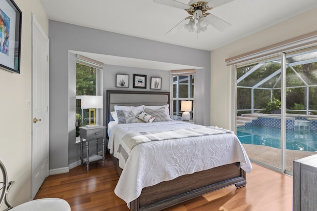 bedroom featuring ceiling fan, access to outside, and dark hardwood / wood-style floors