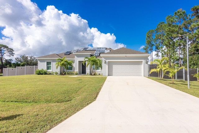 view of front of house with a front lawn, a garage, and solar panels