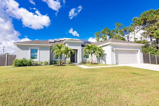 single story home with solar panels, a garage, and a front yard