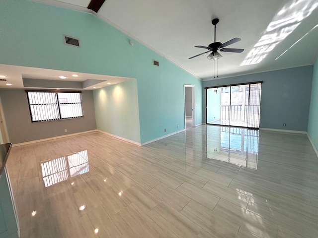 empty room featuring vaulted ceiling and ceiling fan