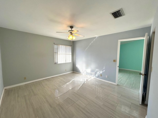 unfurnished room with ceiling fan