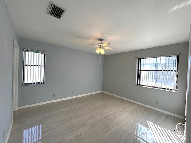 empty room featuring ceiling fan