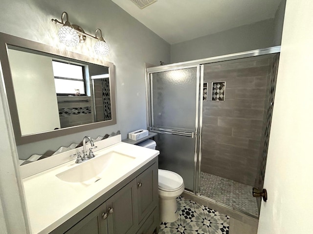 bathroom with walk in shower, vanity, and toilet