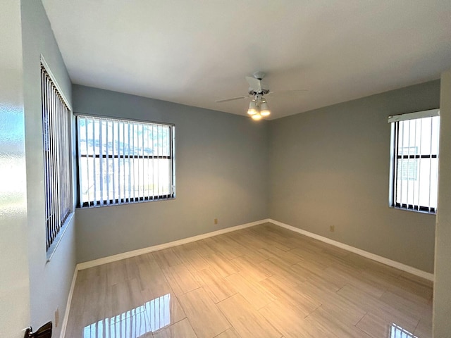 spare room with ceiling fan and light hardwood / wood-style flooring