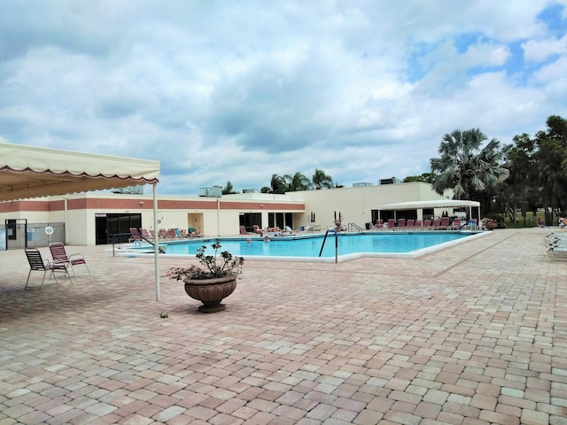 view of swimming pool with a patio