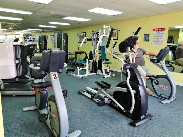 exercise room with a drop ceiling