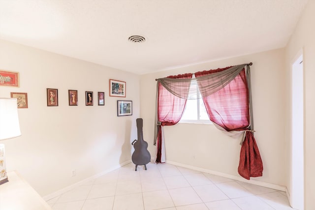 view of tiled spare room